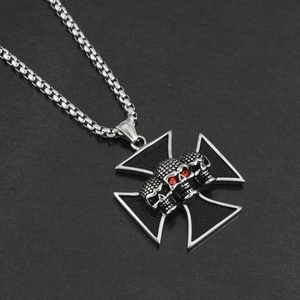 Gothic punk necklace with Maltese cross pendant featuring three skulls and red crystal eyes