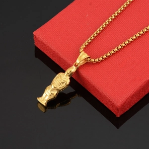 Detailed close-up of golden terracotta warrior pendant on a Venetian chain necklace