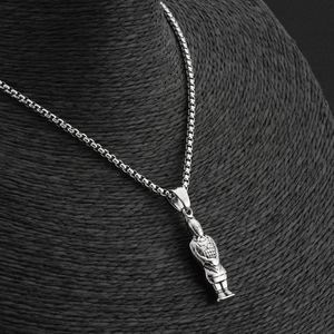 Detailed close-up of a silver Terracotta Warrior pendant on a black textured neck bust