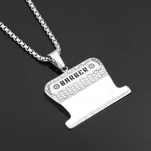 Polished stainless steel barber clipper pendant necklace with engraved lettering on black base