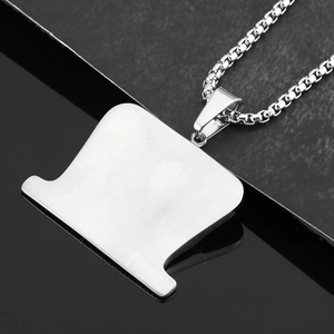 Detail view of silver razor blade pendant on a sturdy steel box chain necklace