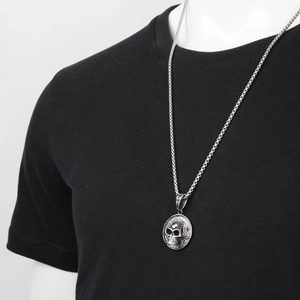 Hip hop style silver 3D skull pendant necklace with square chain on black t-shirt