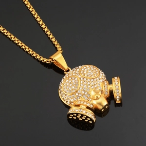 Pendentif masque à gaz hip hop doré orné de pierres de zircone cubique étincelantes