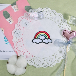 Embroidered rainbow patch with clouds and black edging for DIY clothing accessories