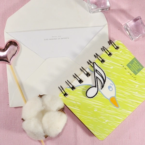 Green spiral notebook with a music note embroidery patch and cute white duck design
