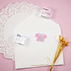 Pink and blue butterfly embroidery patch with gold glitter on pink texture background