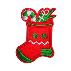 Christmas stocking embroidery patch with candy canes and gift boxes on white background