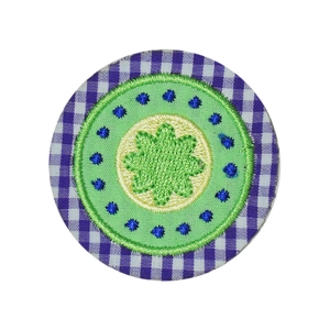 Round floral embroidered patch with purple gingham border and green flower center
