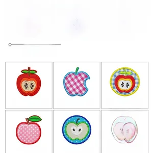 Detail view of colorful apple embroidered patches with precise textile stitching and patterns