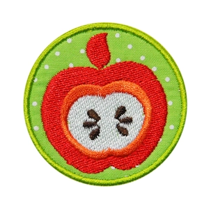 Round apple embroidered patch with red fruit motif and green polka dot background