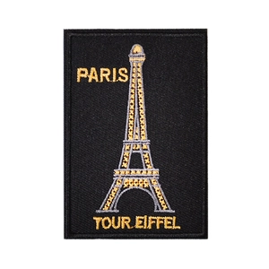 Black rectangle embroidery patch with gold Eiffel Tower and Paris text on white background