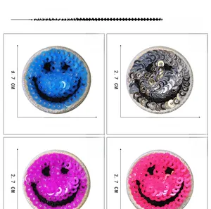 Detailed view of 2.7cm smiley face sequin patches in blue, silver, purple, and pink colors