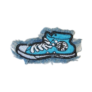 Embroidered high-top canvas shoe patch with star logo and frayed denim edges