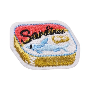 Detailed embroidered sardine can patch with colorful thread and golden edge finish