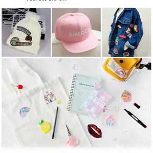 Detailed view of colorful clover and rainbow embroidered patches applied to hats and jackets
