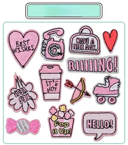 Detailed embroidery texture of pink heart and assorted fashion themed patches