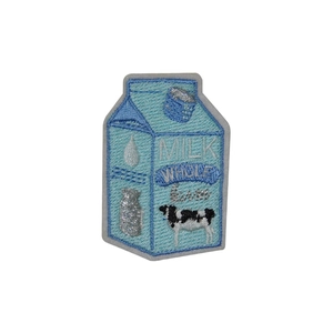 Creative milk carton embroidery patch with blue thread and cow motif on white background