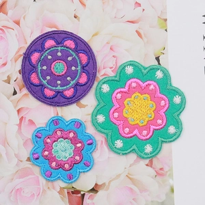 Three colorful daisy floral embroidery patches for clothes decoration and DIY crafts