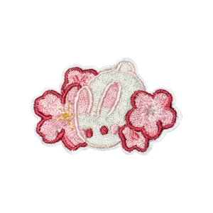 Cute white rabbit embroidery patch with pink cherry blossom details and neat stitching