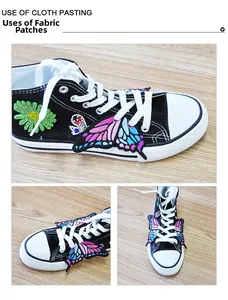 Detailed embroidery patches on black canvas shoes featuring butterflies and daisies