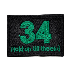 Rectangular black embroidery patch with green number 34 and Hold on till the end text