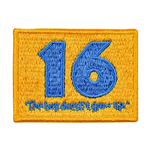 Rectangle blue and yellow embroidered number 16 patch with 'The boy doesn't grow up' text