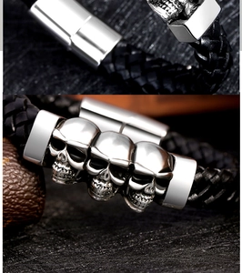 Detail of magnetic clasp and antique silver skull charms on black braided leather bracelet