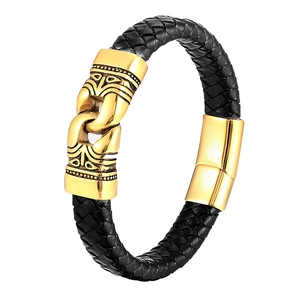 Detail of black braided leather bracelet for men featuring gold magnetic totem clasp