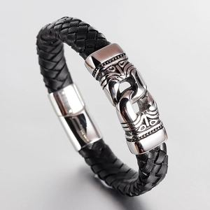 Men's black braided leather bracelet with stainless steel magnetic totem clasp on grey background
