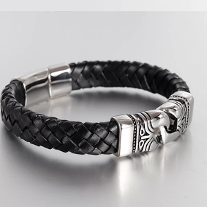Close-up of black braided leather bracelet for men with silver stainless steel tribal clasp