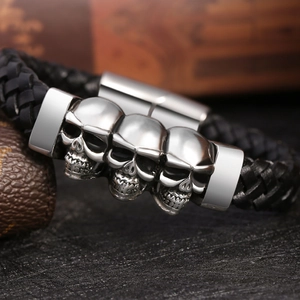 Men's punk skull braided leather bracelet with three silver charms and magnetic clasp