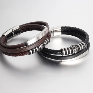Close-up of braided leather bracelets with stainless steel magnetic clasp and vintage details