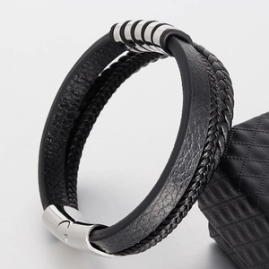 Detail of multi-layer black braided leather bracelet with stainless steel magnetic clasp