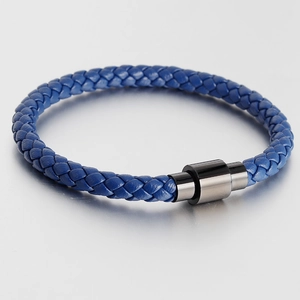 Close-up of blue braided leather bracelet featuring a black magnetic steel clasp