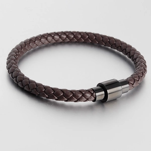 Close-up of men's dark brown braided leather bracelet with black magnetic metal clasp