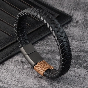 Men's black braided leather bracelet with matte magnetic clasp on stone background