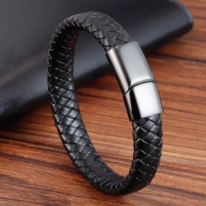 Close-up of black braided leather bracelet with polished gunmetal stainless steel clasp