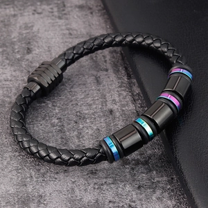 Handcrafted black braided leather bracelet with rainbow metal accents and magnetic clasp
