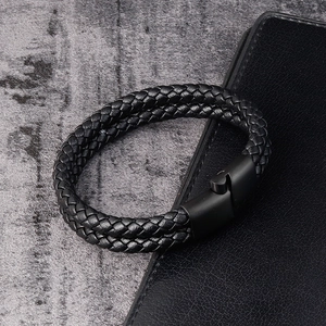 Detail of double-strand woven leather bracelet with matte black magnetic metal clasp