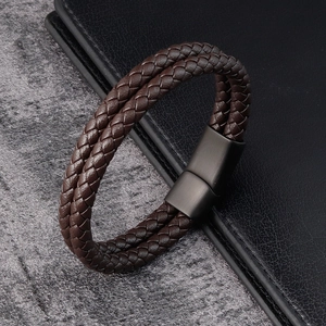 Close-up of men's double-layer braided leather bracelet with black matte magnetic clasp