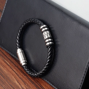 Men's woven black leather bracelet with textured stainless steel magnetic clasp