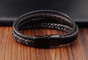 Macro shot of multi-layer braided leather bracelet with matte black magnetic clasp