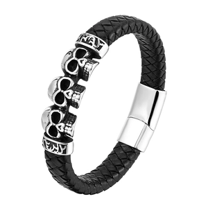 Men's punk braided black leather bracelet with silver skull charms and magnetic clasp