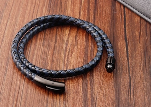 Men double-layer braided leather bracelet with black magnetic clasp on wood