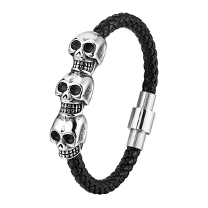 Men's punk braided leather bracelet with three silver skulls and magnetic clasp