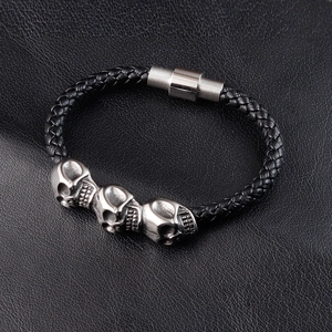 Punk woven leather bracelet with vintage silver skulls and magnetic metal clasp