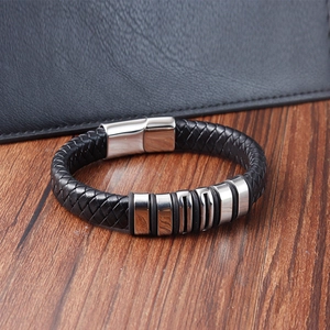 Men's woven black leather bracelet with polished stainless steel rings and magnetic clasp