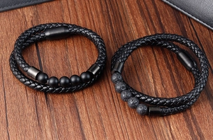 Detail of men's double braided leather bracelets with volcano stone and matte onyx beads