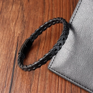 Minimalist black braided leather bracelet for men with smooth matte metal magnetic clasp
