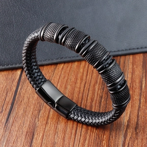 Handmade black woven leather bracelet for men with textured metal rings and magnetic clasp